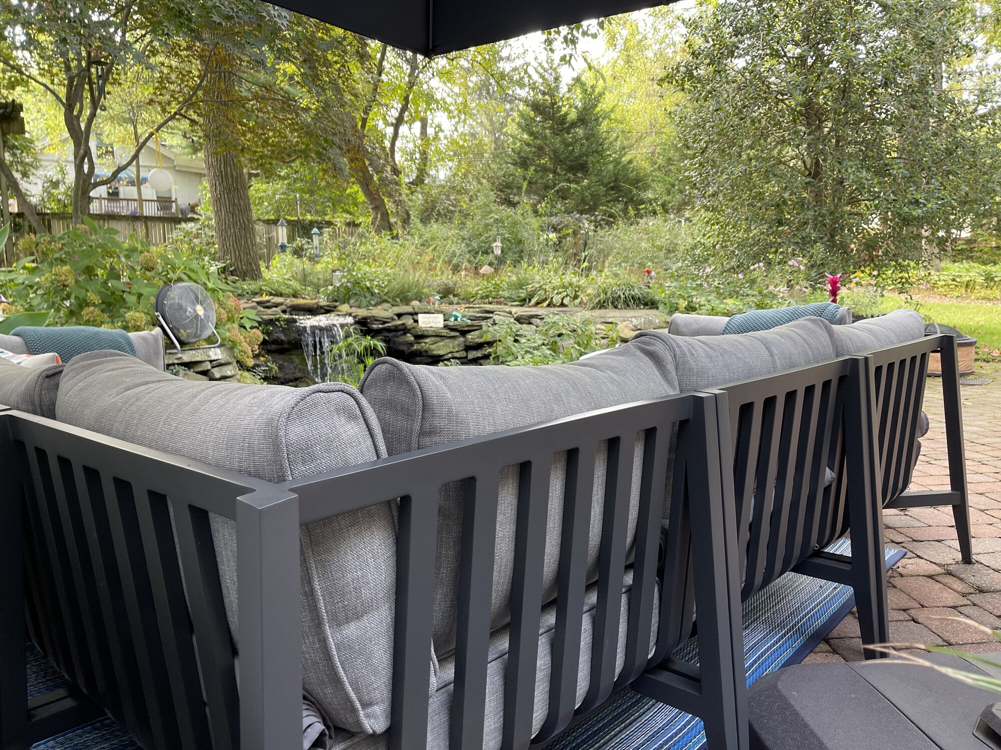 A Mid-Century–Style Patio with Pond Views - Photo 3