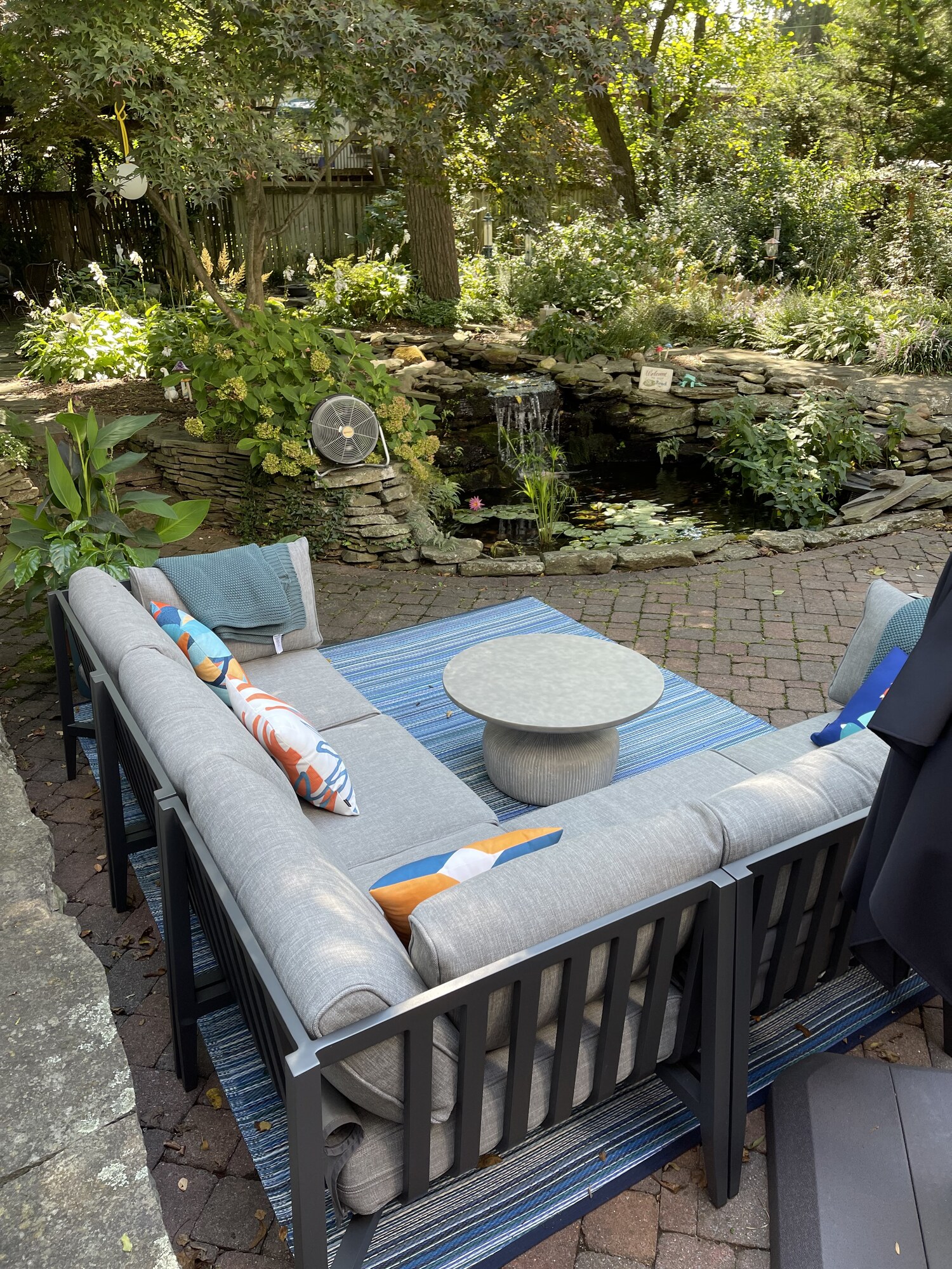 A Mid-Century–Style Patio with Pond Views - Photo 4