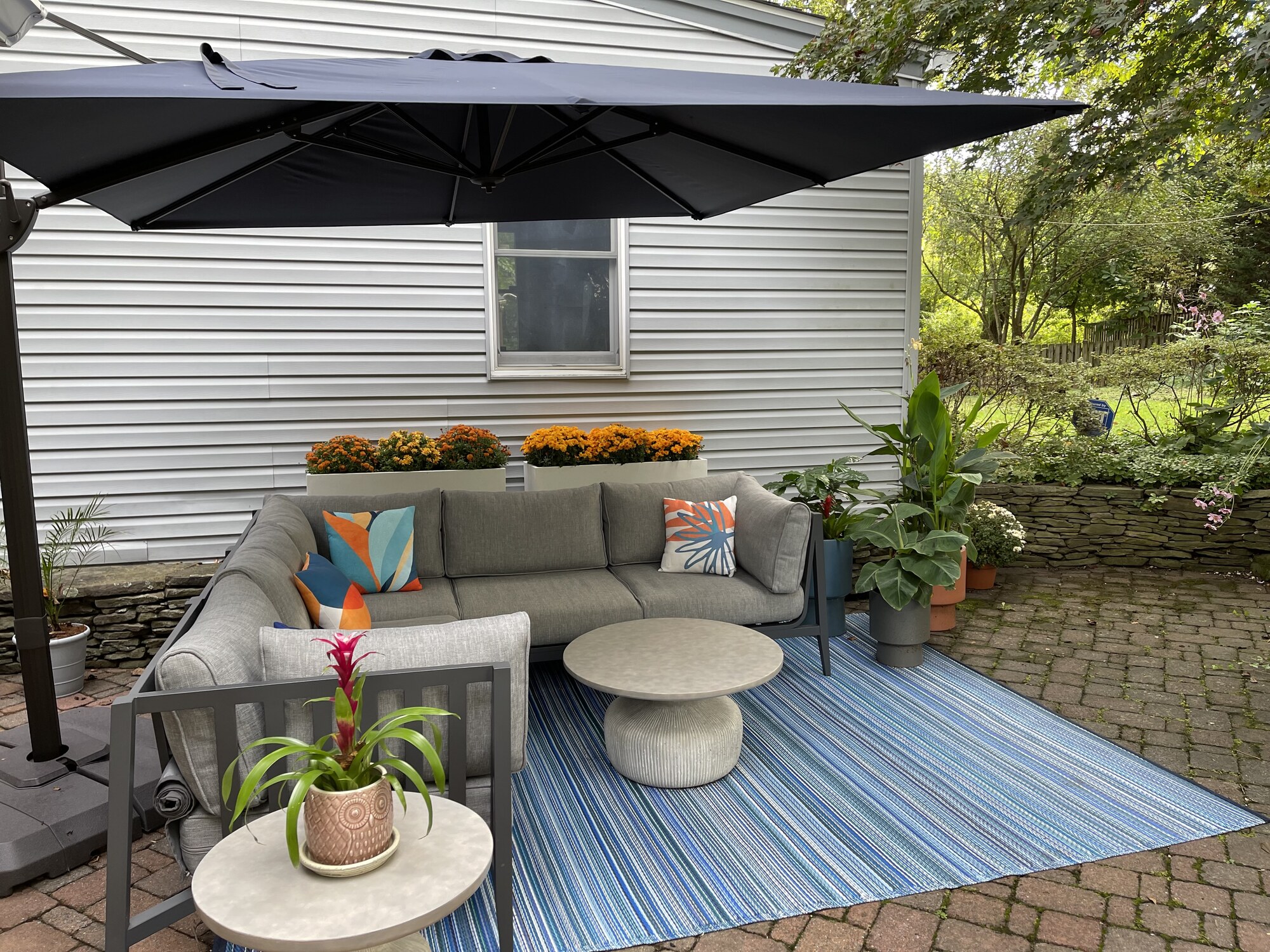 A Mid-Century–Style Patio with Pond Views - Photo 5