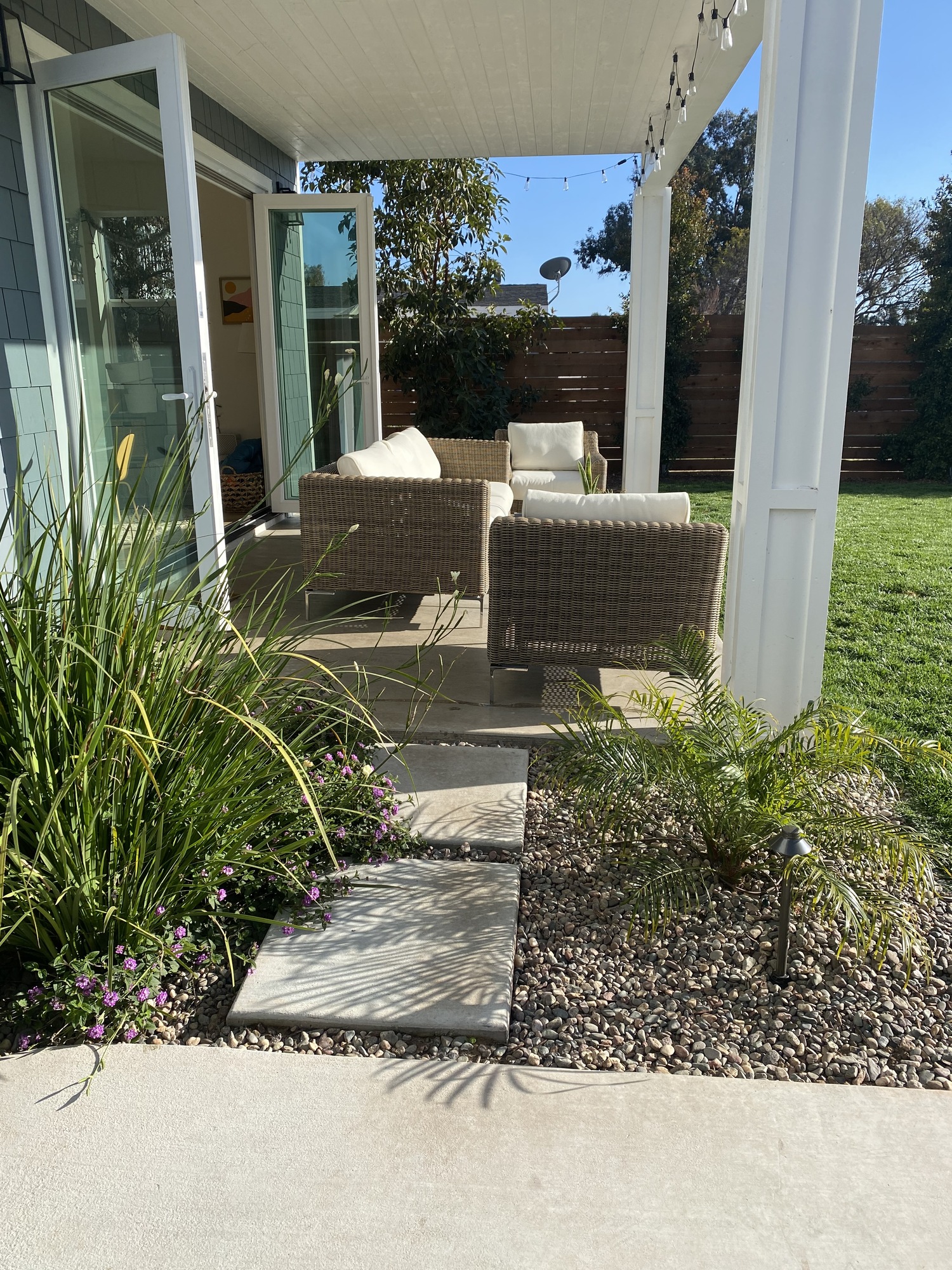 A Modern Beachy Backyard with Covered Patio - Photo 6